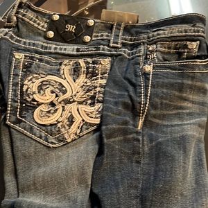 Miss Me jeans with details on the pockets. New never worn.